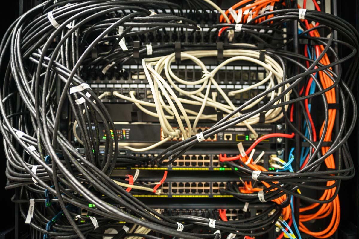 dso IT server closet full of organized and clearly labeled wiring and assets